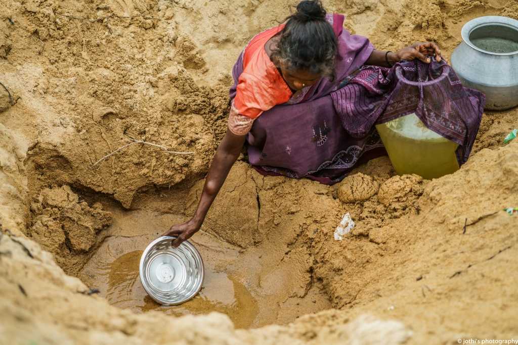 Women collect and carry water from natural springs. This water is used for drinking.